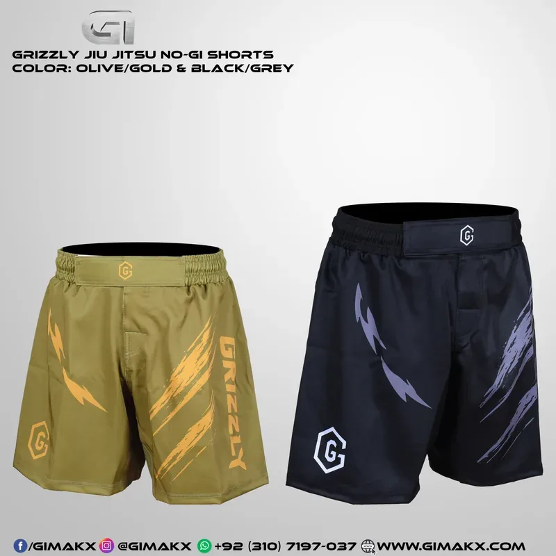 Two pairs of Grizzly Jiu Jitsu No-Gi shorts side by side — olive with gold claw artwork and black with grey claw artwork, both with a branded hybrid closure waistband